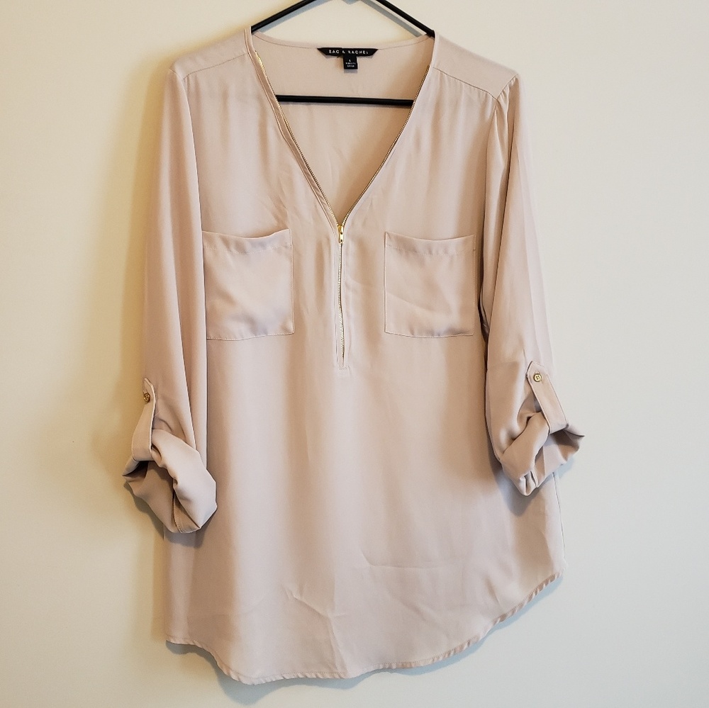 Tan zip-detail blouse with gold buttons on sleeves
